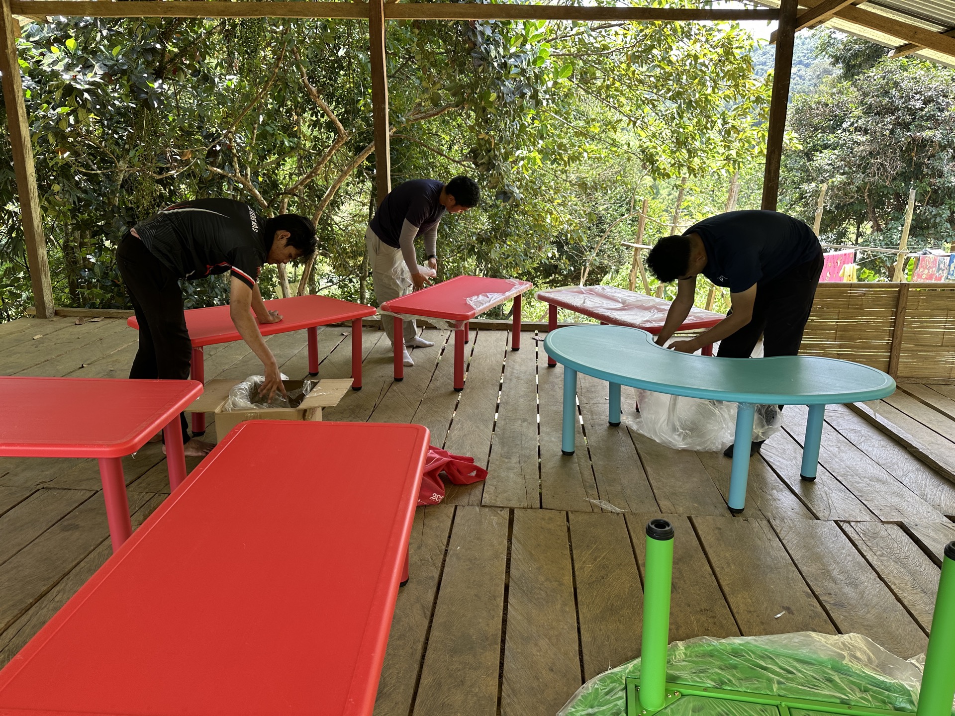 Saora+ learning centre session — Orang Asli children engaged in structured education activities with a trained village educator
