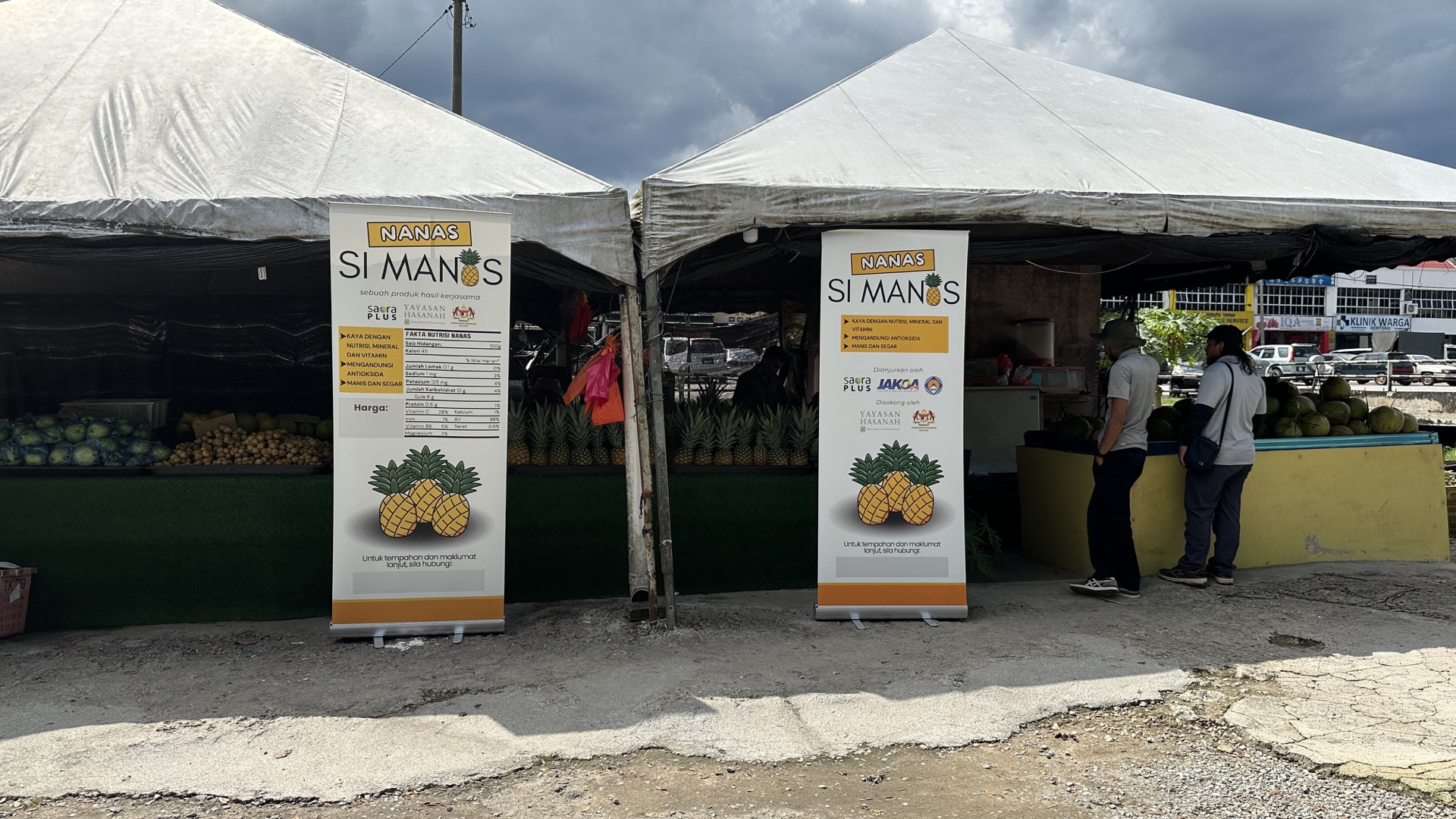 Community meeting discussing economic development planning with Saora+ and village leaders gathered around a table