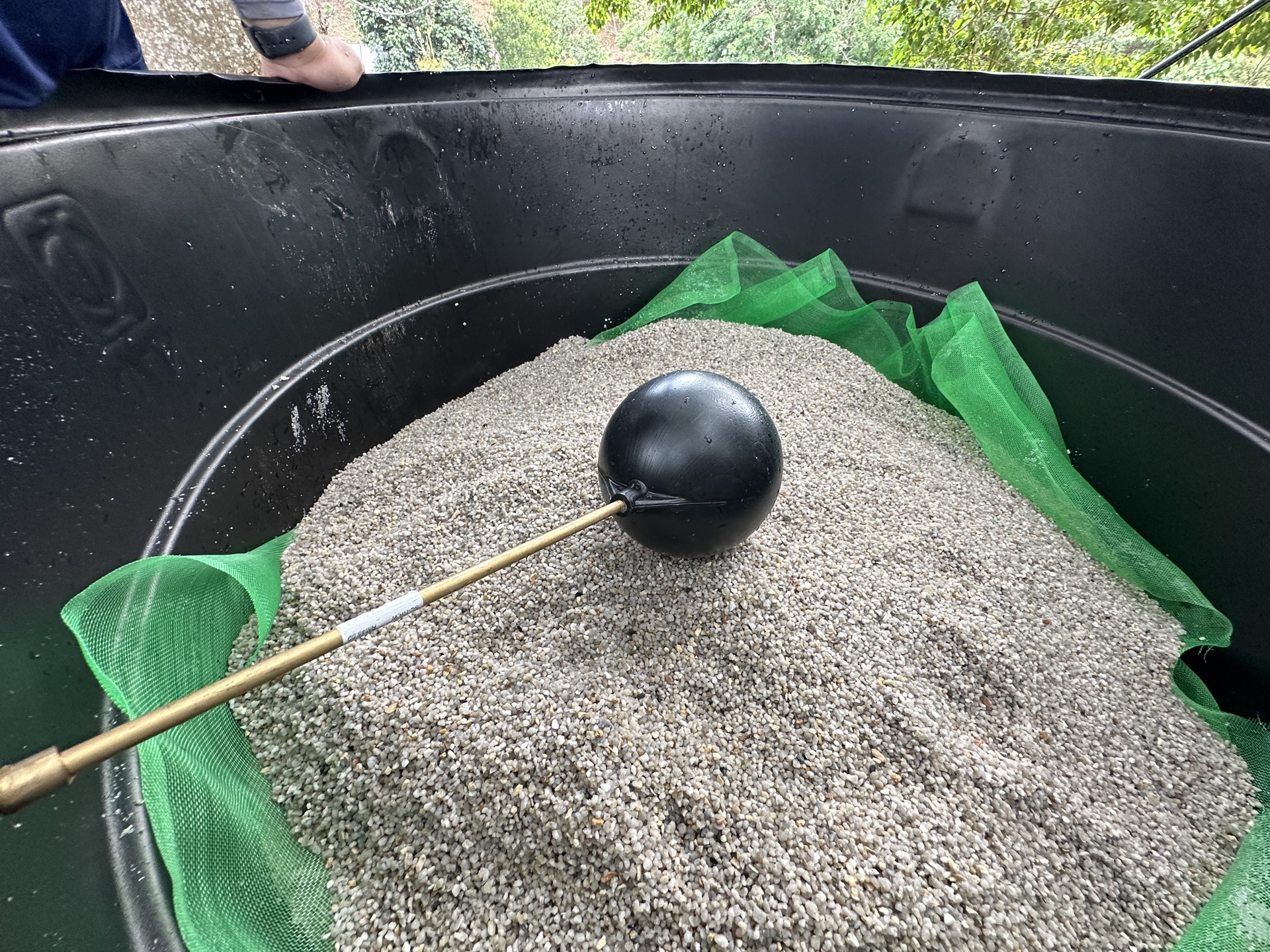 Community members at Kampung Sungai Raba with the newly installed clean water supply point and filtration equipment