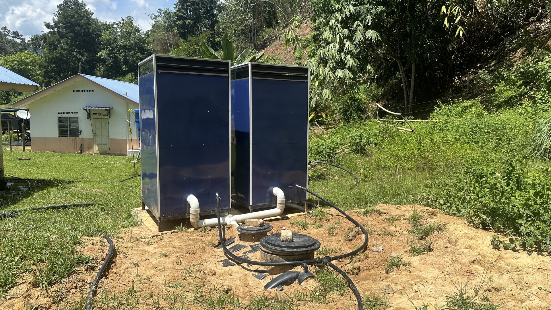 Orang Asli families at Kampung Sungai Raba accessing clean water from the Saora+ gravity-fed system